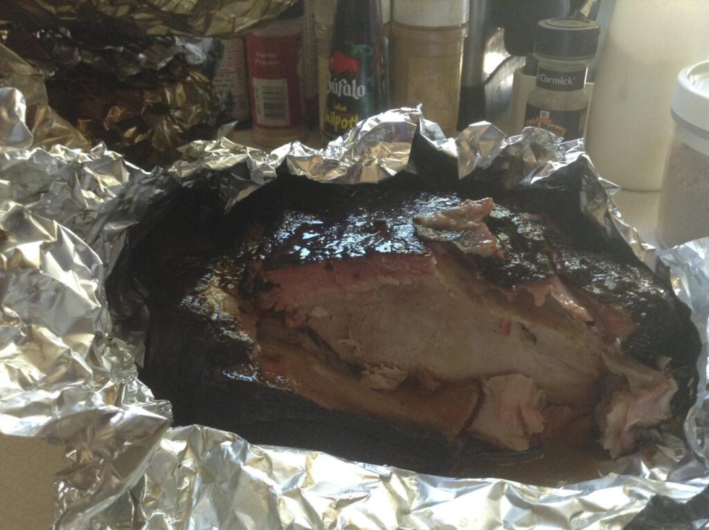 Pork roasts done and I've sliced into one showing the red smoke ring in the meat